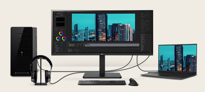 Front view showing a workstation with multiple devices connected to monitors.	