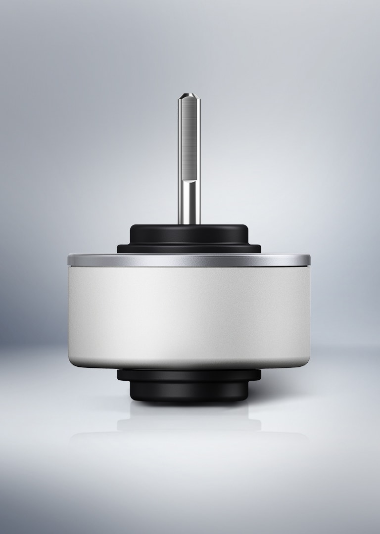 Front-facing view of an LG BLDC fan motor component on a reflective surface, showcasing the rotor shaft and cylindrical housing.