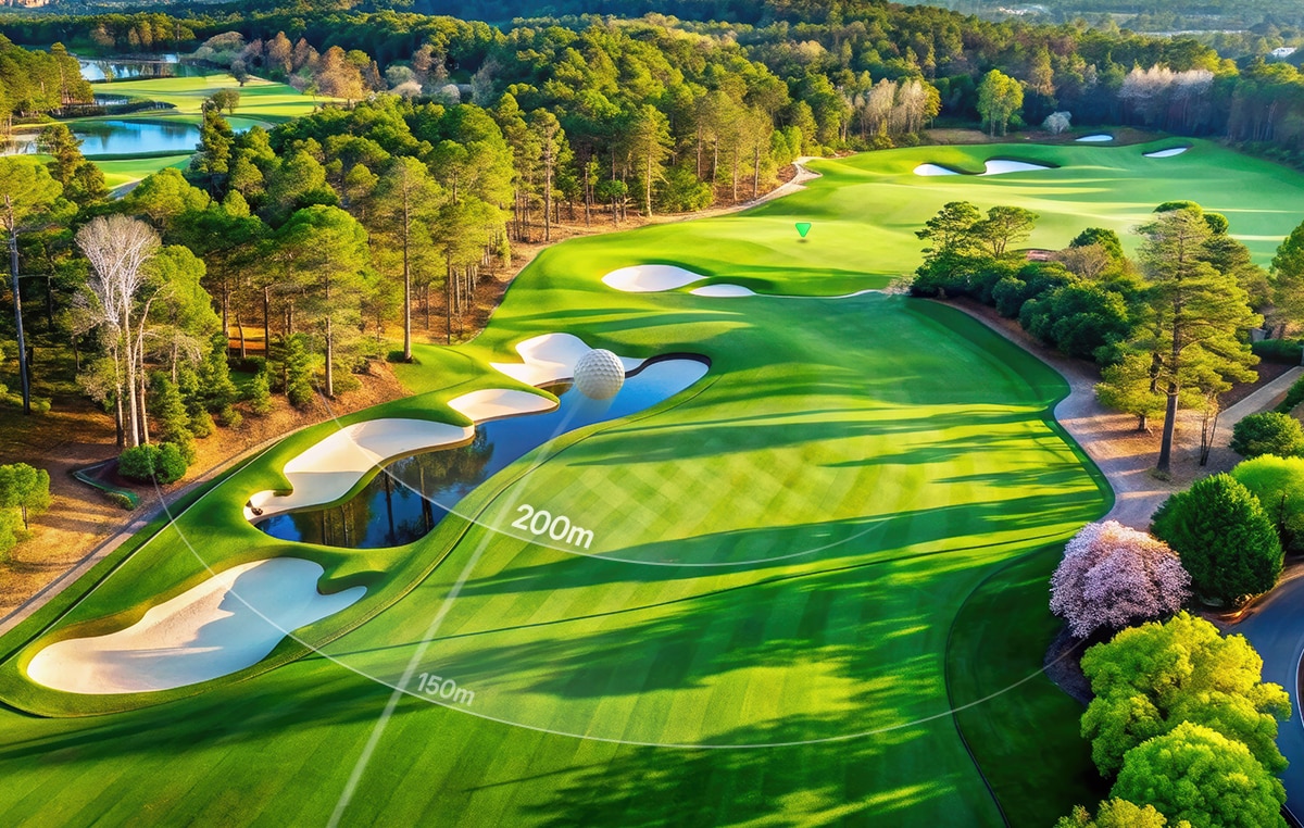 There is a stunning aerial view of a golf course with sand bunkers, water features, and distances marked as 150m and 200m. There is a stunning aerial view of a golf course with sand bunkers, water features, and distances marked as 150m and 200m.