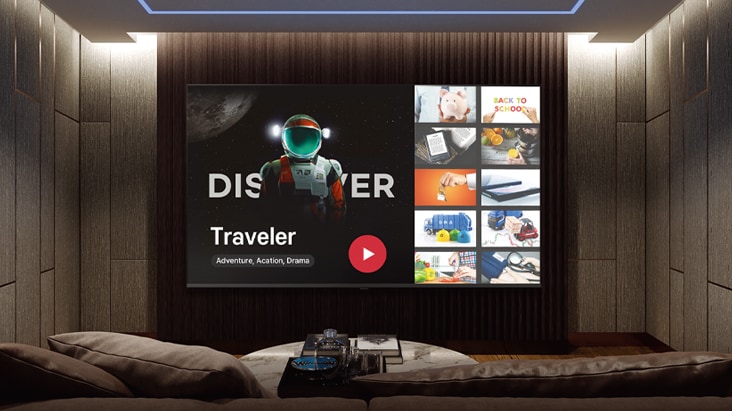 This image shows a large screen in a room, highlighting the option to choose from multiple channels.