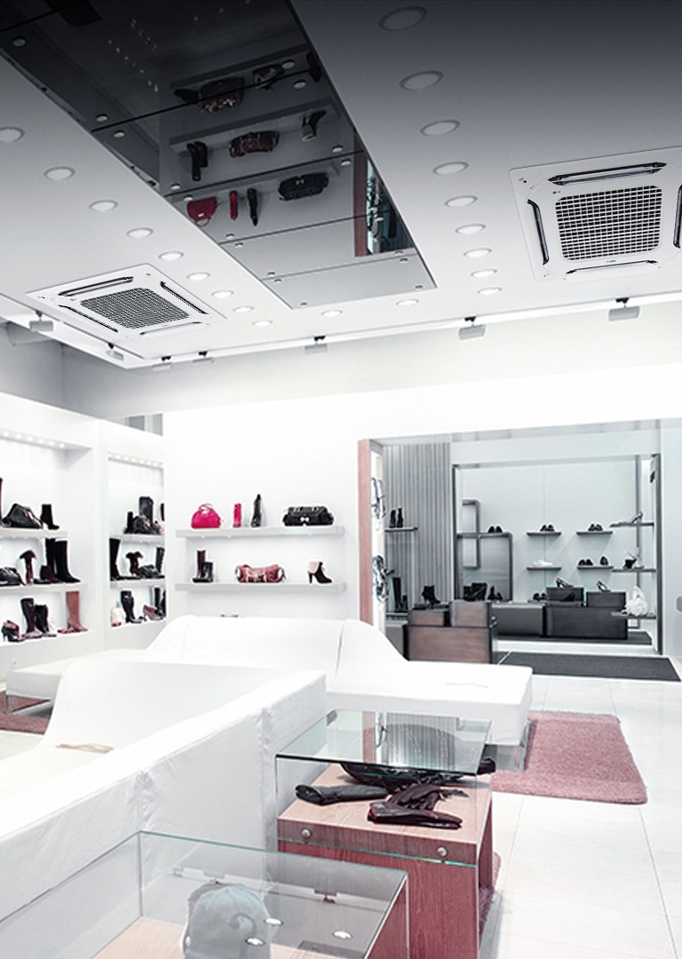 Interior of a modern retail shoe store equipped with LG MULTI V indoor units. The ceiling shows multiple cassette-type air conditioning units, providing climate control throughout the shop, which is furnished with shelves displaying shoes and handbags