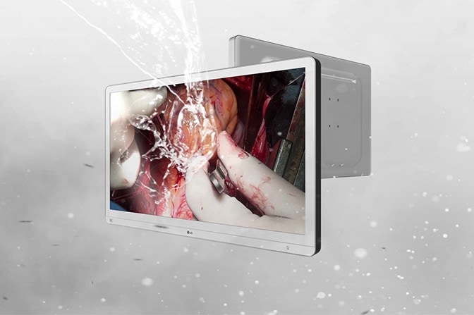 The video shows a medical display being splashed with water, highlighting its IP45 rating for the front and IP32 for the rest, indicating water and dust resistance.	
