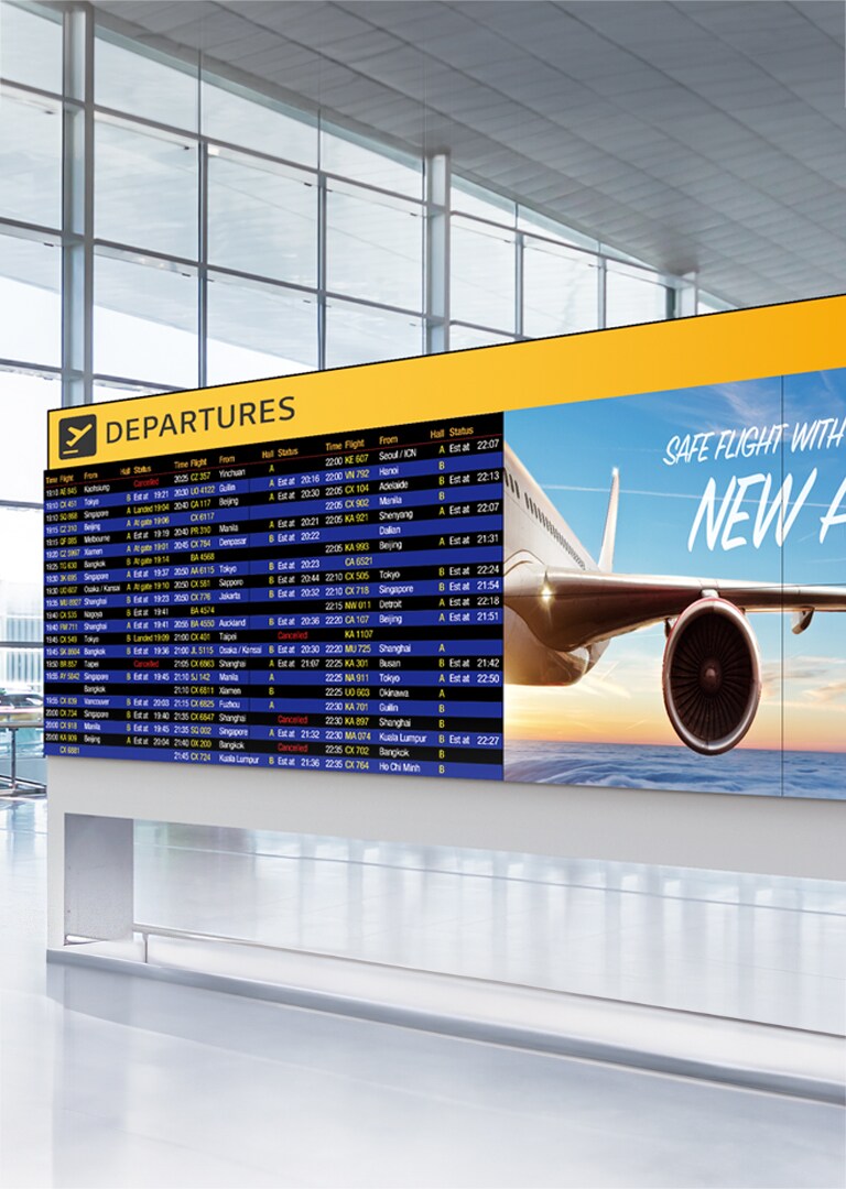 LG Video Wall at an airport departure lounge displaying synchronized flight information and airline promotions. Seamless LG Video Wall enhances passenger experience with vibrant visuals and reliable digital signage.