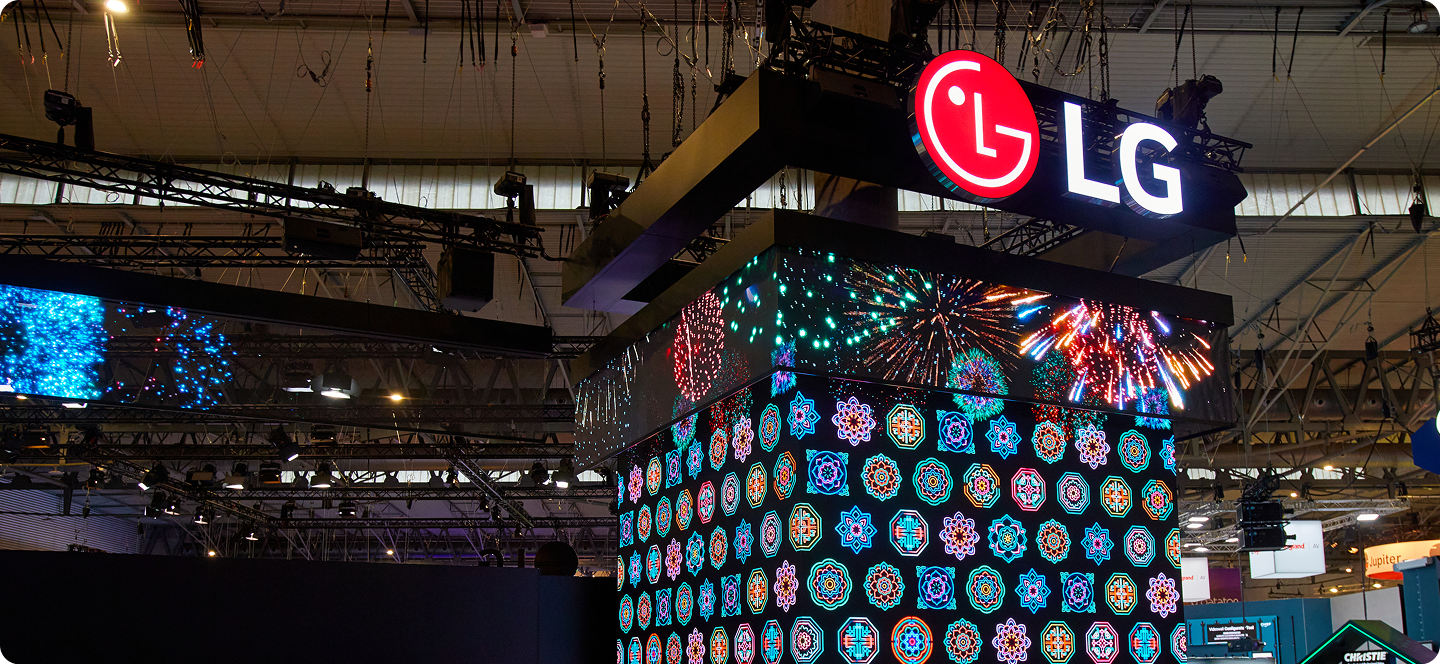 A close-up of the three-sided LED tower showcases the massive scale and vibrant digital patterns of LG’s showstopping entrance.