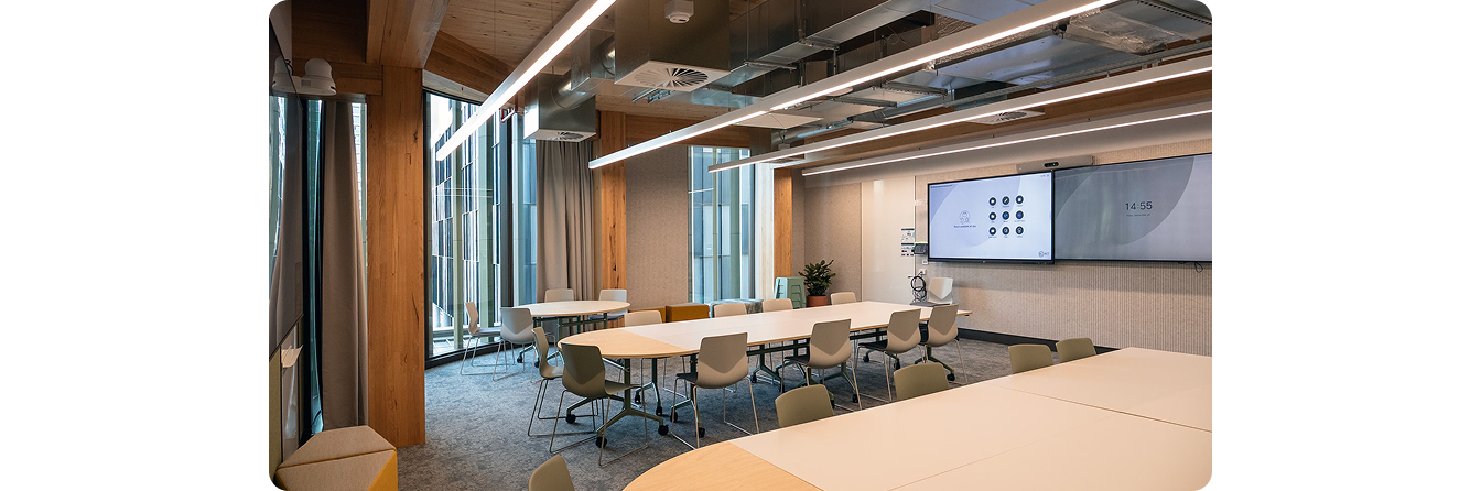 Front-of-room dual-display layout at CIT Woden Campus, with 4K signage next to interactive display