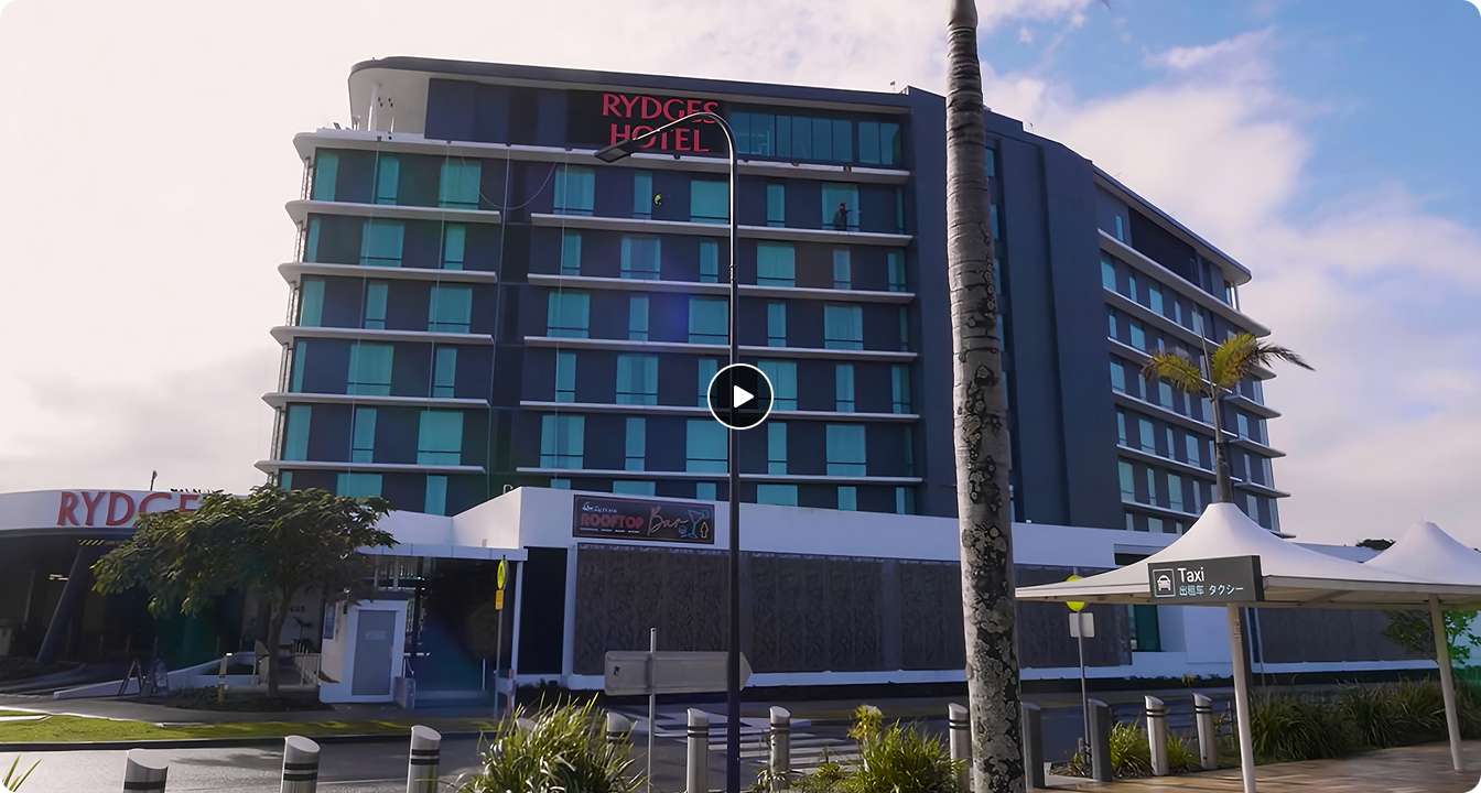 Video thumbnail showing exterior of Rydges Gold Coast Airport Hotel in Australia featured in the LG Commercial Display hospitality case study video