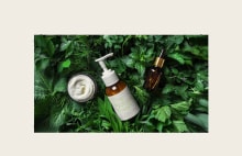 LG commercial display showcasing skincare and cosmetic products on green leaves. LG signage solutions supporting retail promotions with vivid, realistic visuals