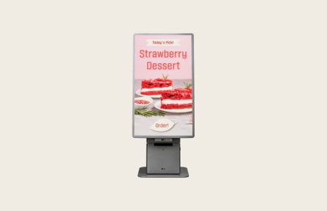 LG digital kiosk promoting strawberry dessert menu in retail store.