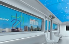 G digital signage inside subway train showing interactive map and sky ceiling visuals. LG transportation display solutions enhancing passenger experience.