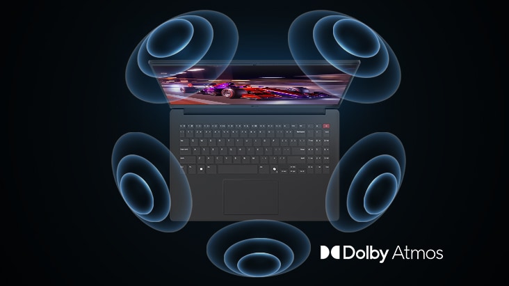 'The image shows a top-down view of a laptop with a vibrant, purple-themed graphic on the screen. Surrounding the laptop are dynamic sound wave visuals, indicating an immersive audio experience. The "Dolby Atmos" logo is displayed in the bottom right corner.