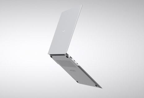 Video shows a laptop partially open from the side with a slim side profile.