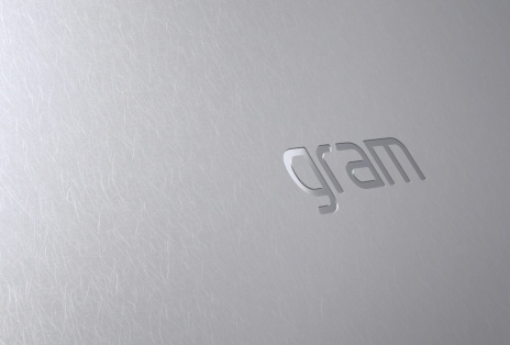 Video shows small stones falling onto the laptop cover surface.