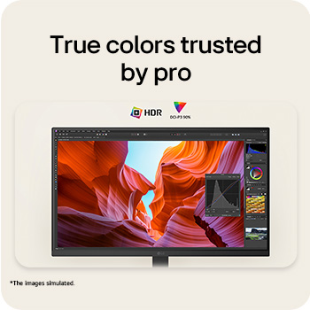 Front view of a monitor displaying a colorful abstract image on a sleek black stand.
