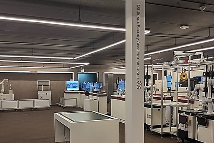 Interior of LG Smart Factory Acceleration Center with advanced robotics, automation systems, and digital displays