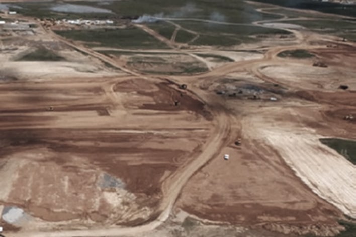 LG engineering consulting visual showing aerial land survey for health checks and site selection, ensuring optimized factory location planning