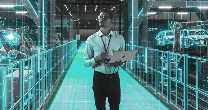 Factory technician monitoring equipment health via LG digital dashboard for predictive maintenance and efficient management.