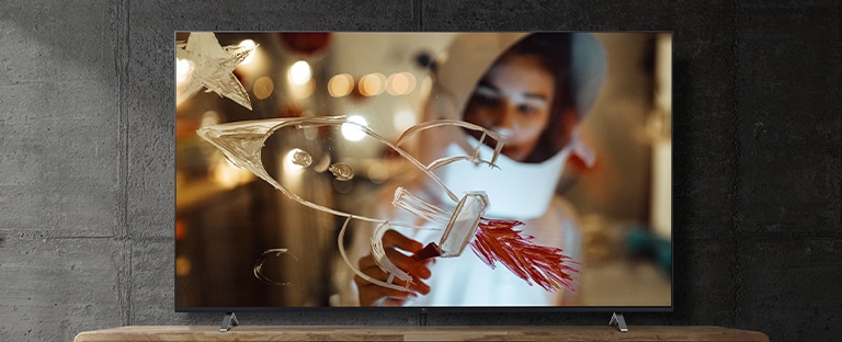 On the TV screen, the movie is displayed with vivid colors and detail.