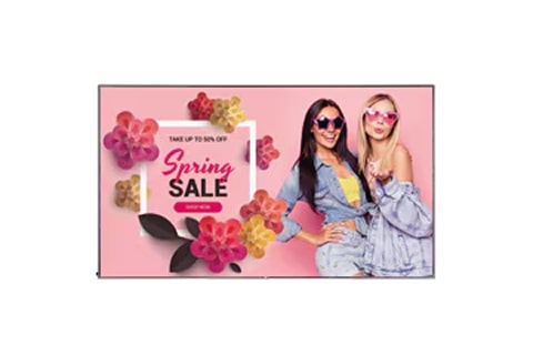 Digital signage screen showing a pink-themed spring promotion with decorative flowers and two women posing in stylish clothing, displayed against a light background.
