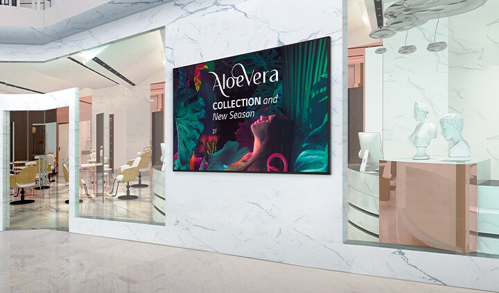 Signage installed on the interior walls of the shopping mall displays advertisements vividly.	