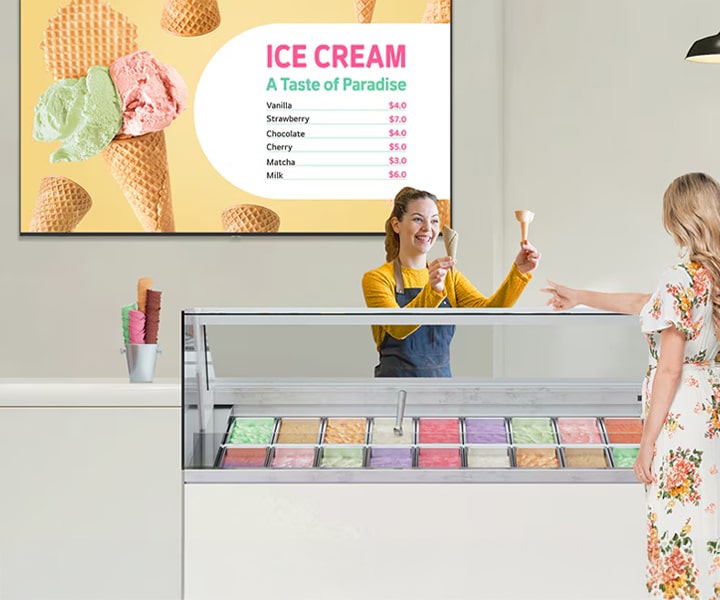 LG Professional TV displaying a vivid ice cream menu in a modern dessert shop with 4K UHD clarity. Commercial digital signage solution from LG designed to enhance customer engagement and elevate business spaces
