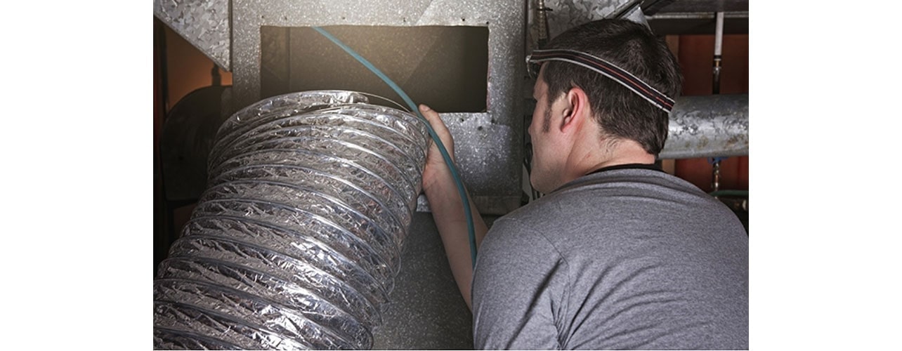 The man next to the pipe.