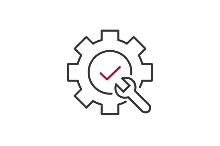 A cogwheel with a red wrench inside it and a red checkmark in the center.