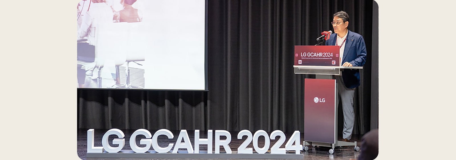 Collage of images from the 2024 LG Alumni Event, including a speaker on stage, attendees listening, a group photo, and a close-up of an event booklet.