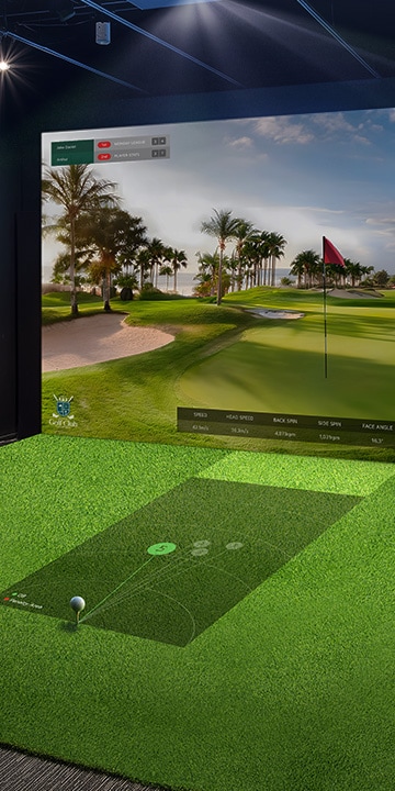 A golf simulator with moderate brightness; the projected screen appears dim and less vibrant, reducing visual clarity. 