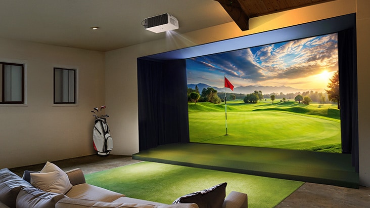 A residential space with an LG ProBeam projector displaying a scenic golf course at sunset. 