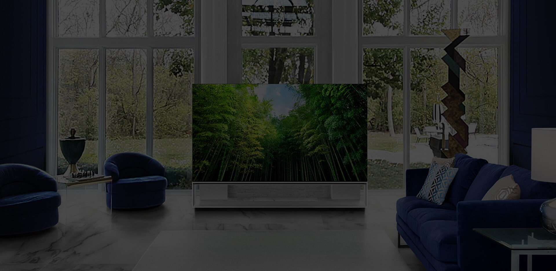 LG SIGNATURE OLED 8K TV is placed in the centre of living room, which is decorated with white marble and the colour of classic blue.