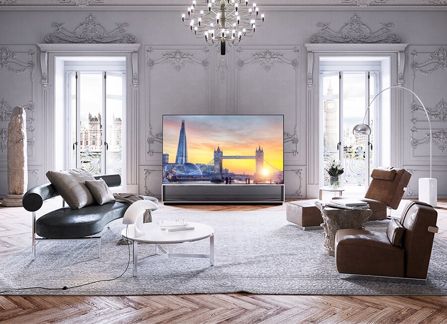 LG SIGNATURE OLED 8K TV is placed in the room amongst the Victorian cornices and parquet floors with Flexform's furnishing items.