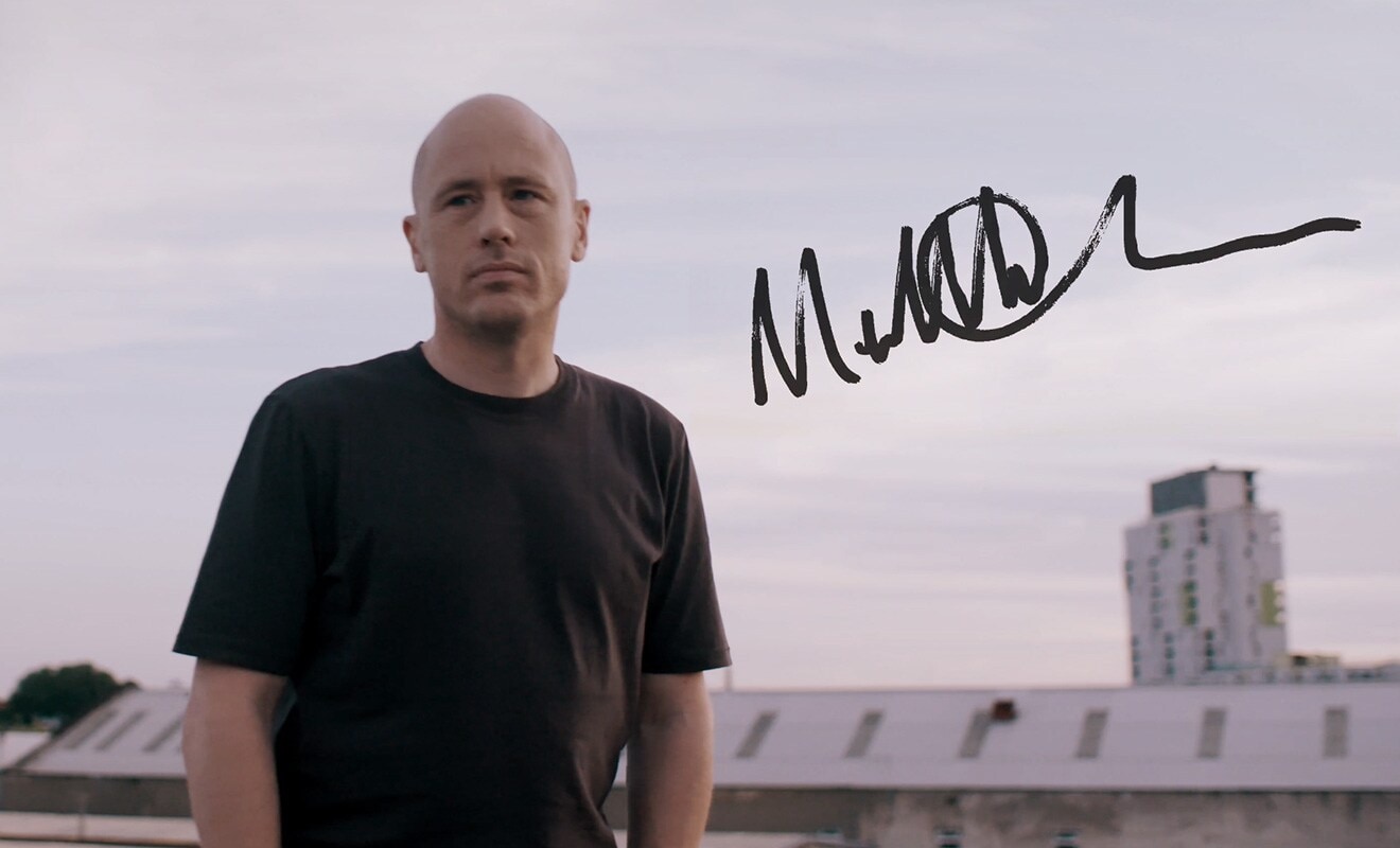 Photograph taken outside of Matt Clark with his autographt written on