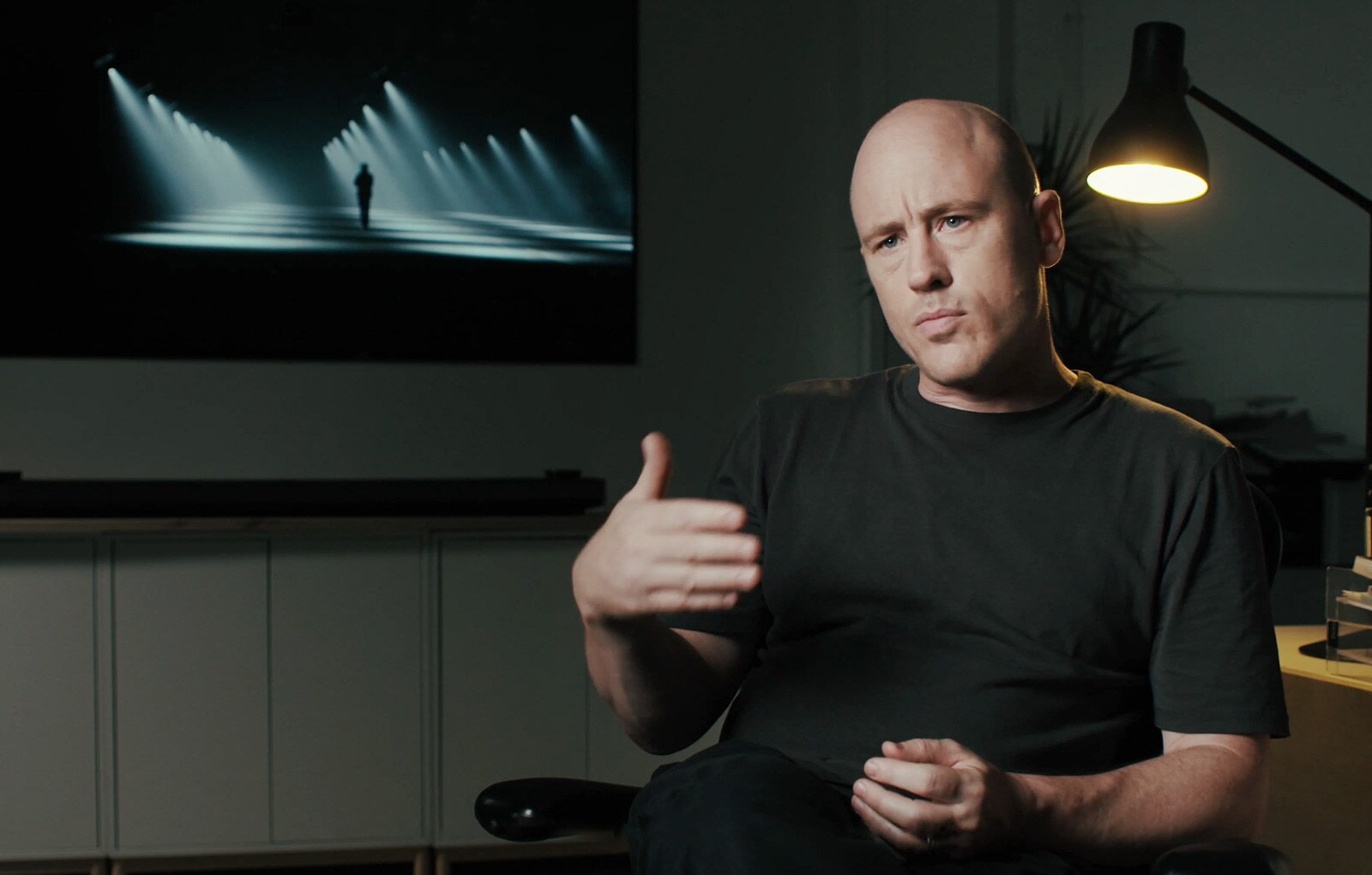 Matt Clark is interviewing with LG SIGNATURE OLED TV W hung on the wall behind