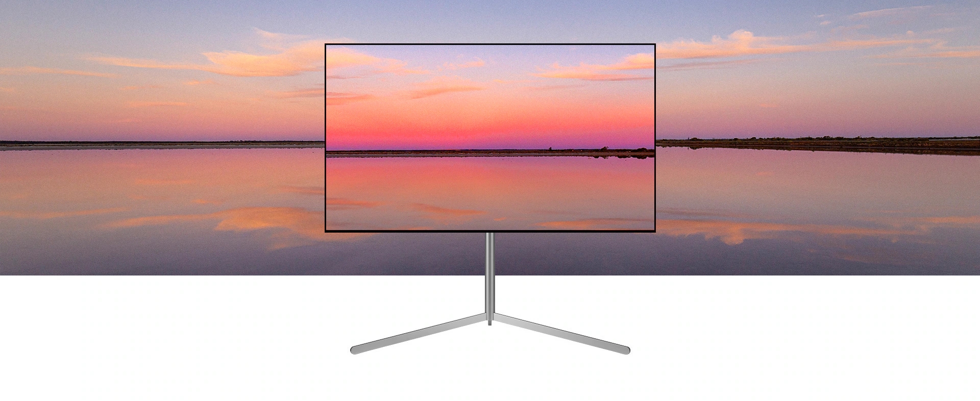 Een LG OLED televisie op een Gallery Stand toont een blauwe en roze zonsondergang die opgaat in de achtergrond