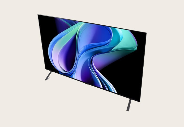 Uma TV LG plana vista de um ângulo superior, exibindo uma imagem abstrata e vibrante com formas em movimento em tons de azul, roxo e turquesa. A TV tem suportes discretos e um design fino, destacando seu estilo moderno e minimalista.