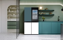 LG refrigerator with screen panel in a modern kitchen interior with green cabinets and open shelving