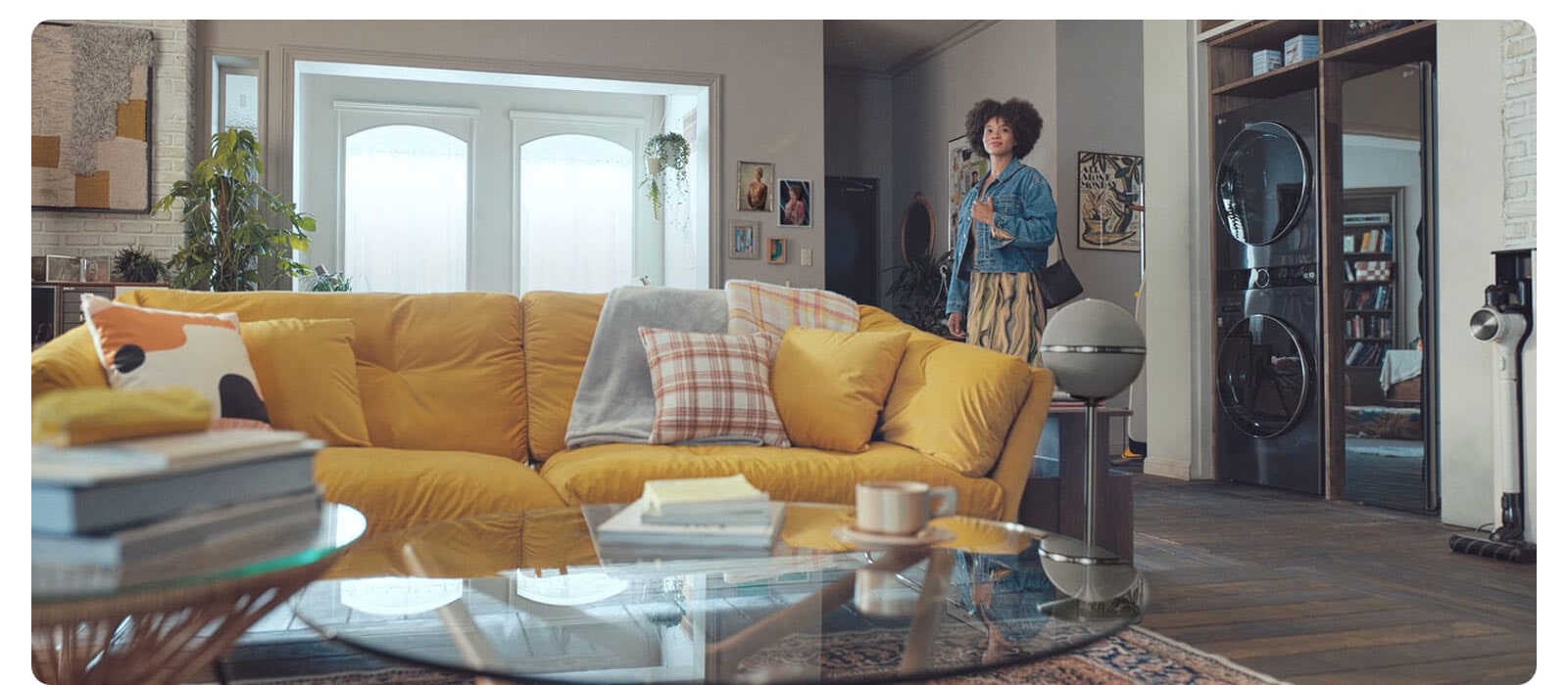 Woman standing in the living room satisfied with a healthy environment