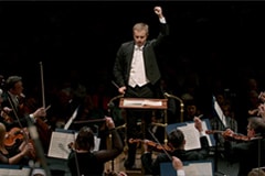 This is an image of the Royal Philharmonic Orchestra performing onstage.