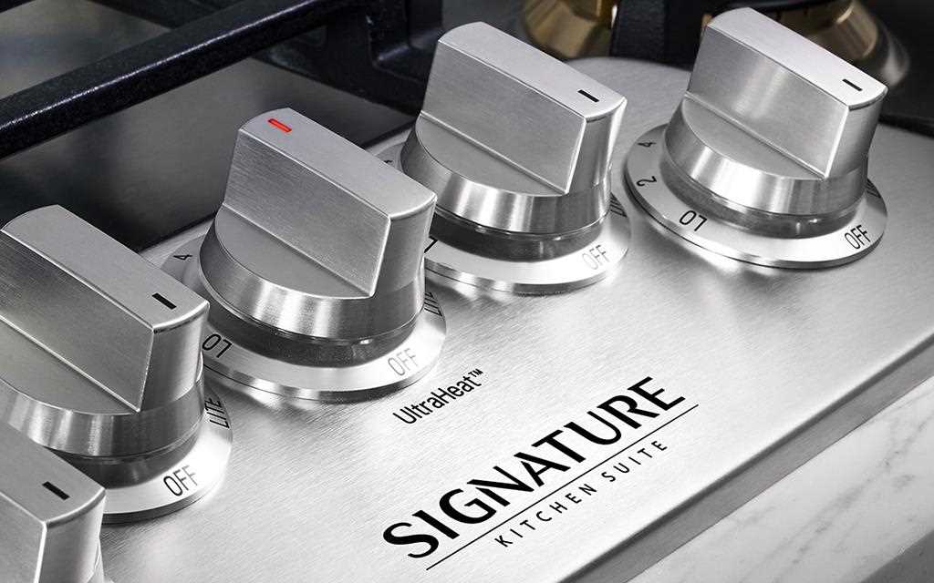 A close up view of the lg signature kitchen suite dual-fuel pro range knobs. 