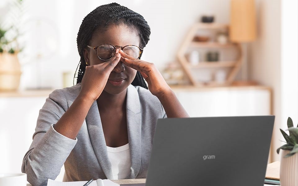 A woman rests her eyes to prevent eye strain