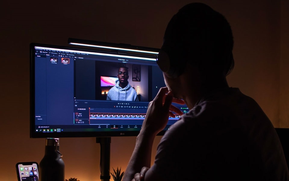 A man adjusts the brightness on his eye-friendly monitor