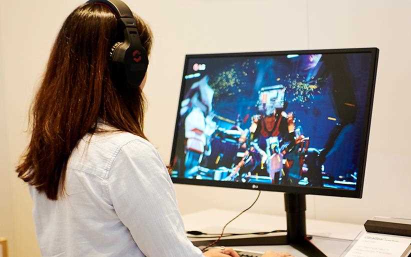IFA 2018: A woman plays a video game on the LG 27GK750F Monitor, on show in the gaming section of the exhibition