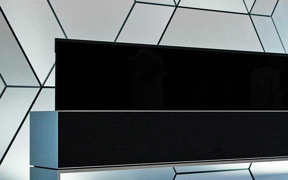 An LG SIGNATURE OLED Rollable TV in line view.