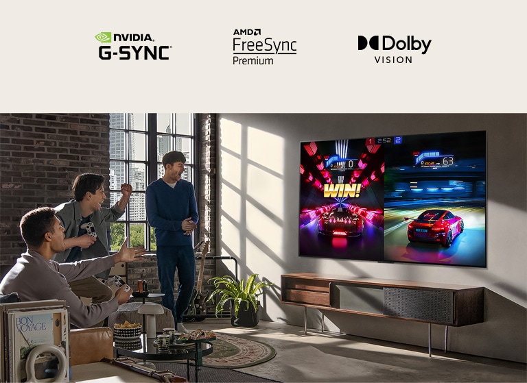 An image of three men playing a racing game on an LG OLED TV in a modern city apartment.