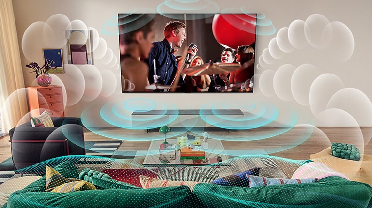 Изображение OLED-телевизора LG в комнате, где идет музыкальный концерт.  Пузыри, изображающие виртуальный объемный звук, заполняют пространство.