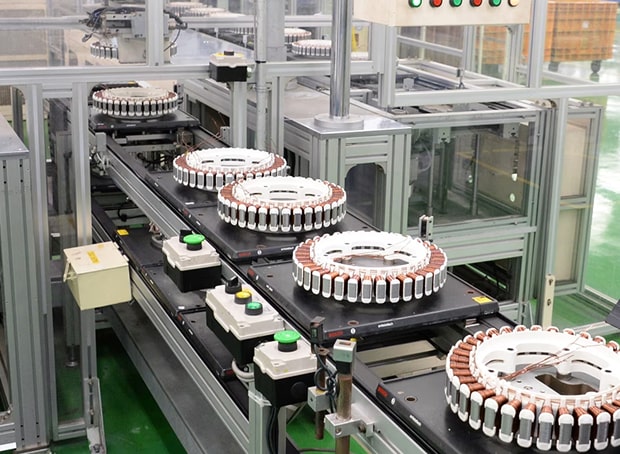 Automated production line assembling high-efficiency inverter DD motor coil components used in LG home appliances, illustrating the manufacturing process of LG's core motor technology designed to improve energy efficiency and reduce power loss