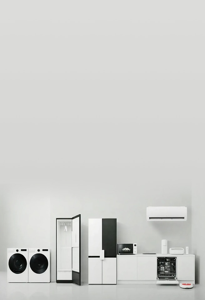A display of various LG home appliances—including a washer, dryer, Styler, refrigerator, microwave, dishwasher, and air conditioner—presented together to illustrate the LG Comfort Kit concept, an assistive accessory designed to make home appliances easier for everyone to use