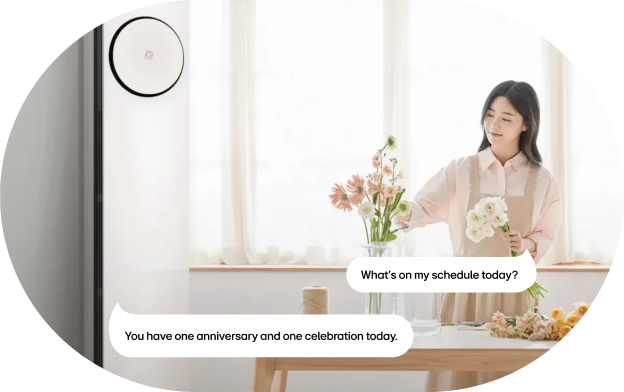 A user checking saved schedules by voice command through the LG ThinQ app while using an LG air conditioner