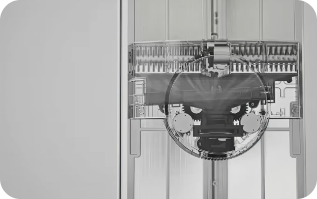 An internal view of an air conditioner's filter cleaning mechanism, showing gears and detailed components designed for automatic filter cleaning.