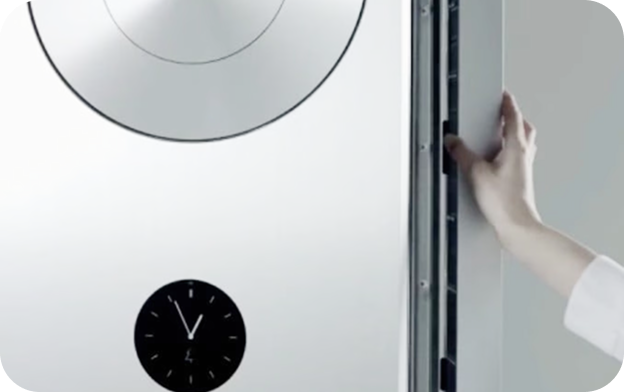 A white standing air conditioner featuring the 'Auto Moving Filter' system. The filter slides out automatically for easy maintenance when a button is pressed.